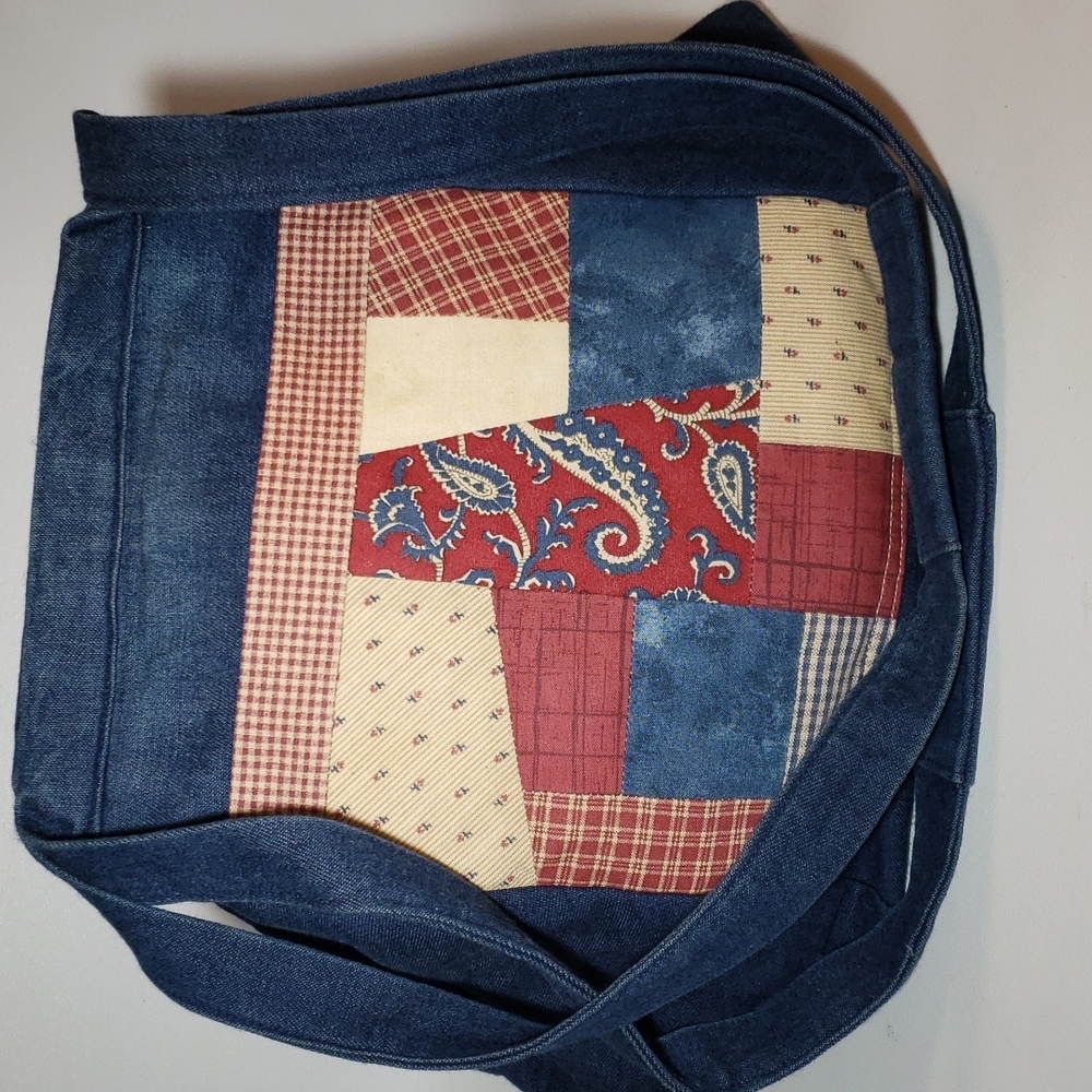 Handmade quilted patchwork denim and cloth women's hobo bag.